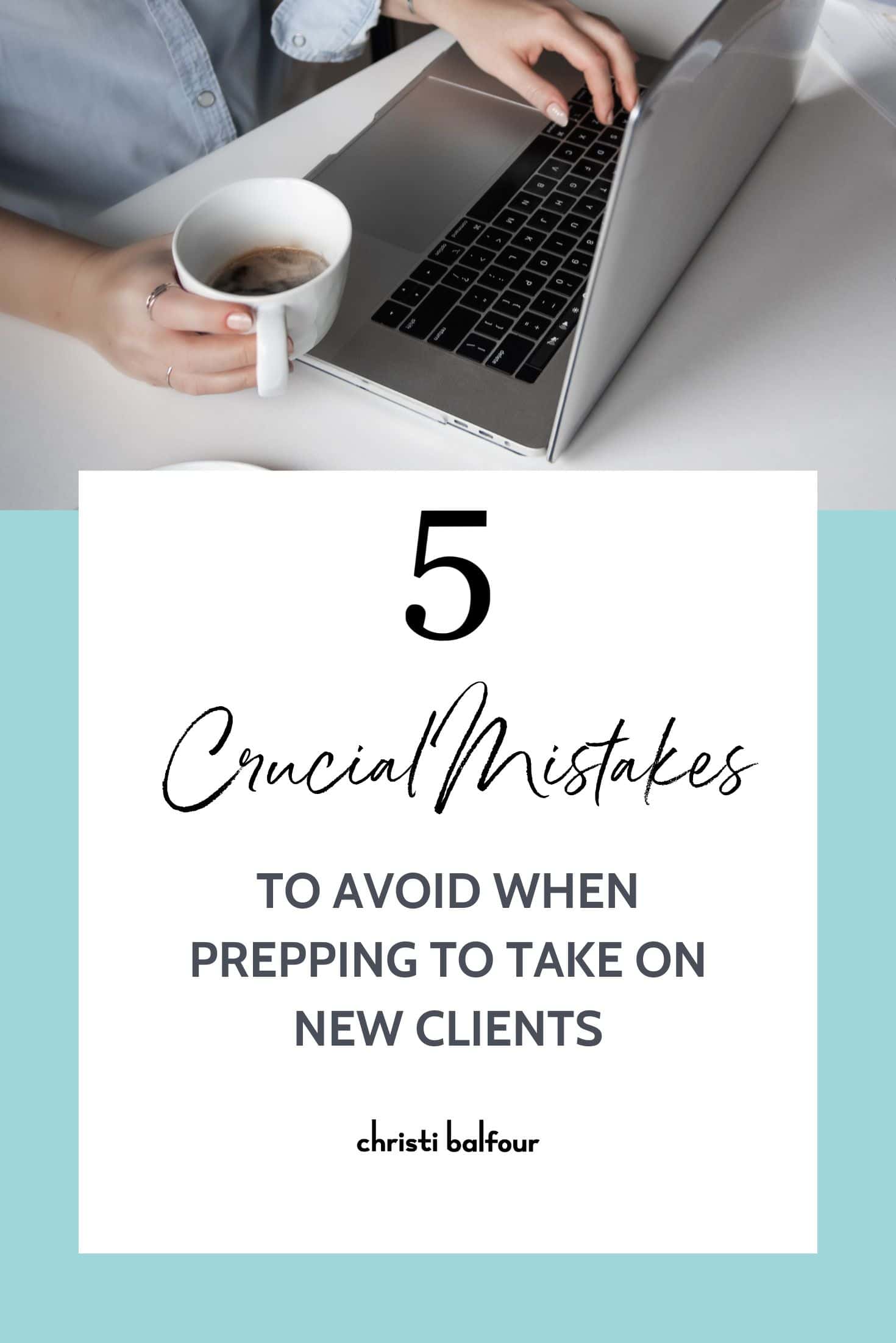 a laptop and a hand holding a cup of coffee